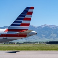 American Airlines aircraft tail and Bridger Mountain range 
